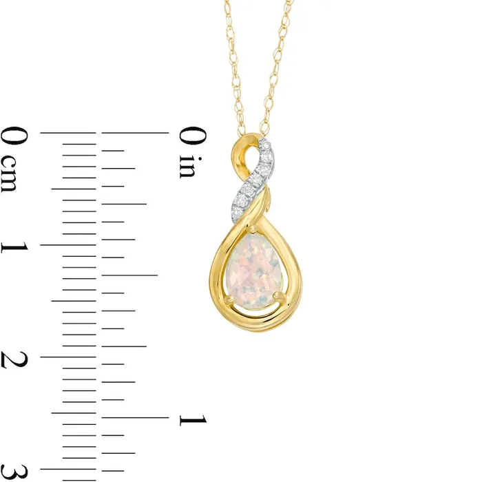 Goldia Necklaces PearShaped LabCreated Opal and Diamond Accent Cascading Teardrop Pendant in 10K Yellow Gold Goldia Necklaces PearShaped LabCreated Opal and Diamond Accent Cascading Teardrop Pendant in 10K Yellow Gold